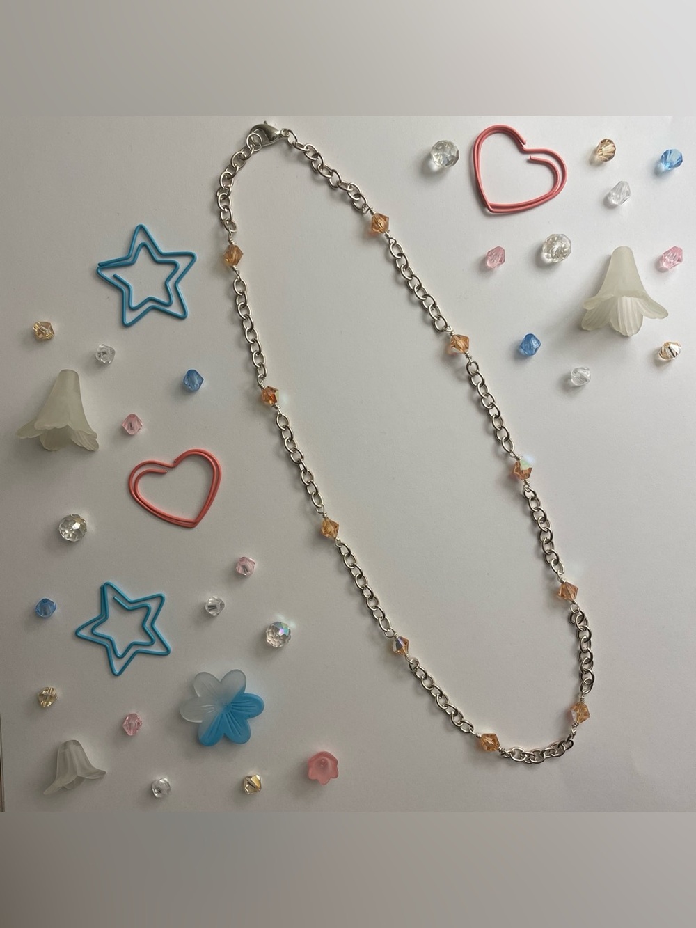 Silver chain necklace with orange beads